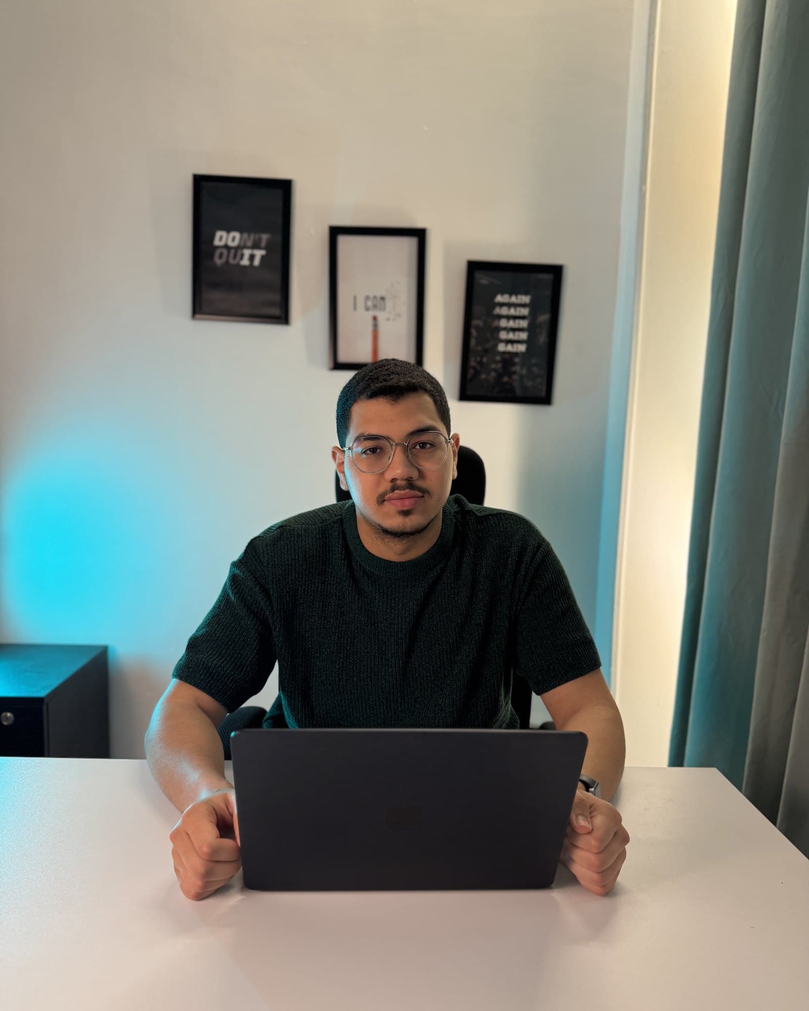 Seif Gomaa, performance media buyer, at his desk in Cairo